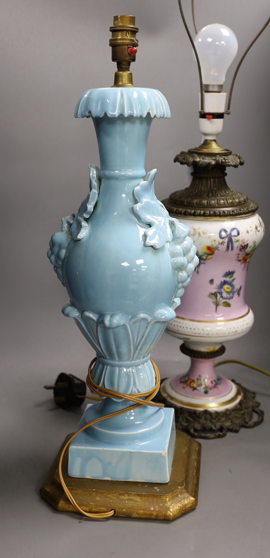 A Victorian brass mounted bone china table lamp and another